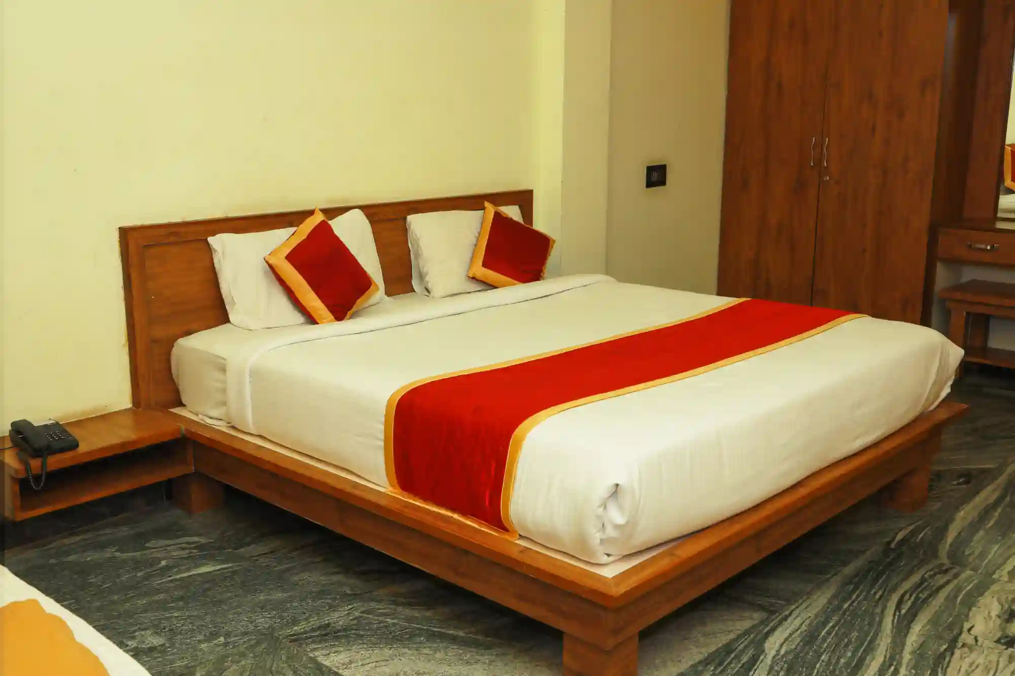 Deluxe Triple Room with king bed at MS Lotus Resorts